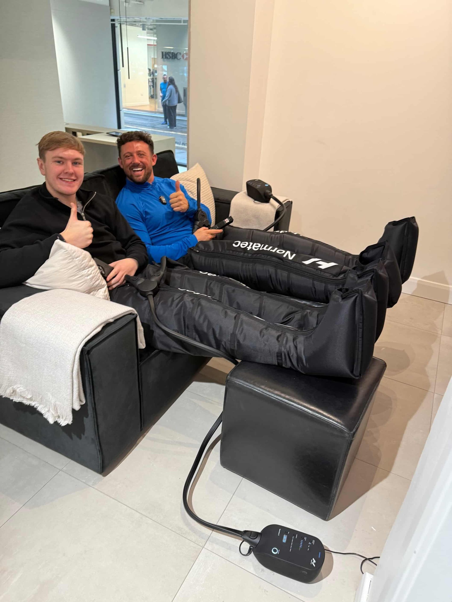 Two-person compression boot therapy session at Brysk in Manchester