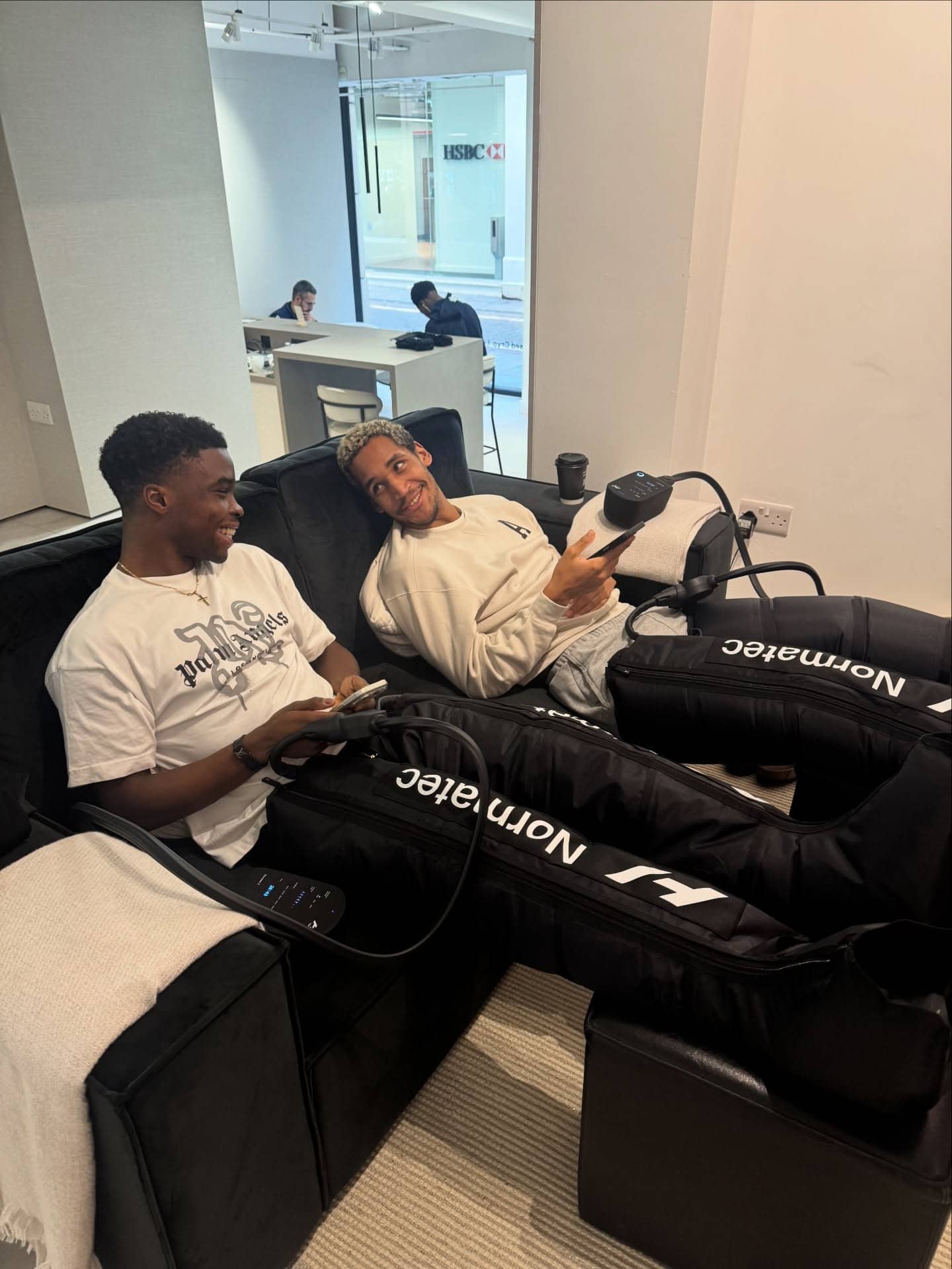 Two clients using compression boots together at Brysk in Manchester