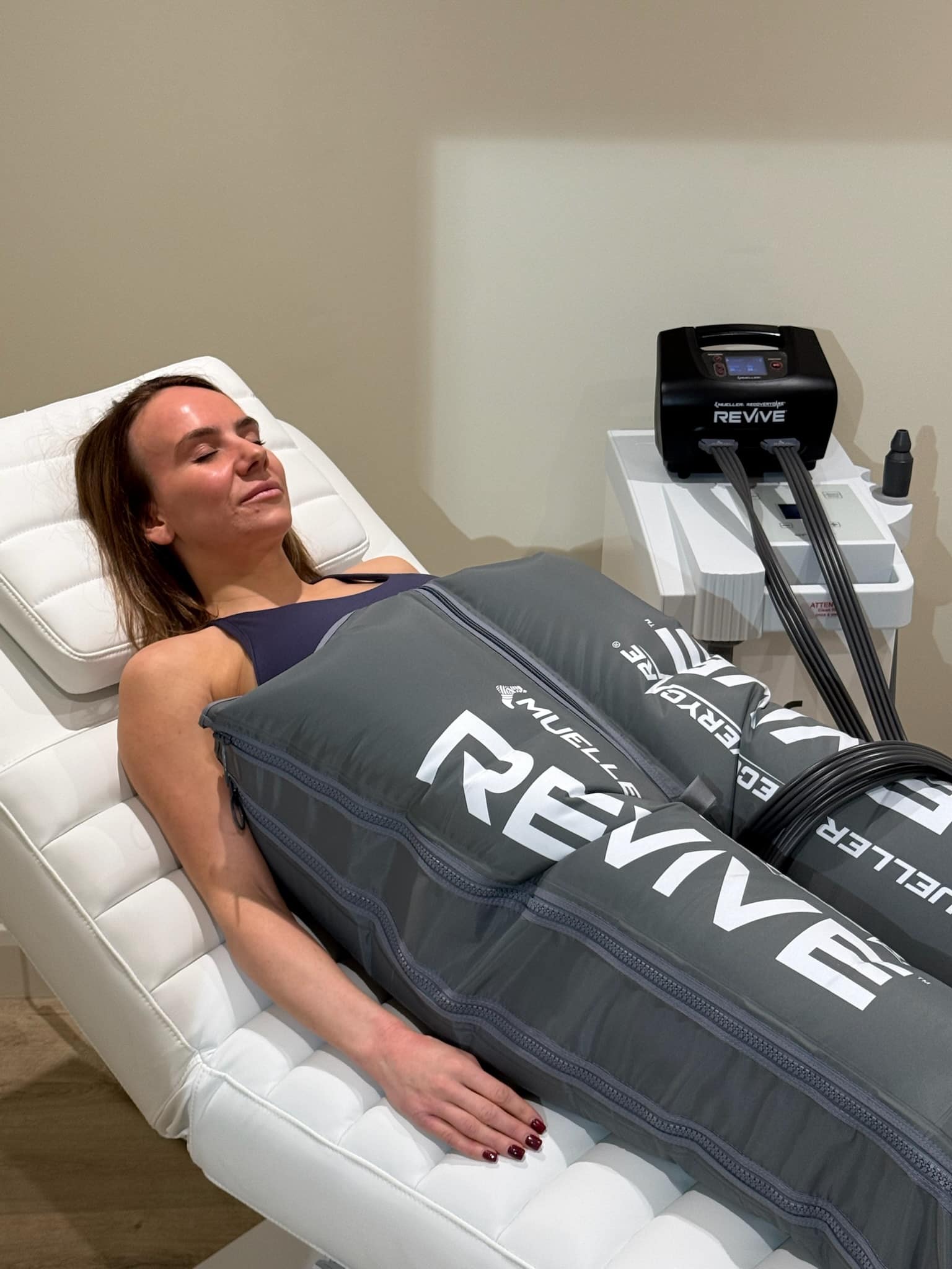 Client using full body lymphatic drainage compression garments at Brysk in Manchester